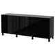 A black BESTÅ sideboard with a sleek, modern design. It includes three compartments with adjustable shelves, and stands on sturdy wooden legs.