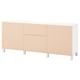 White BESTÅ sideboard with light wood doors and silver legs.