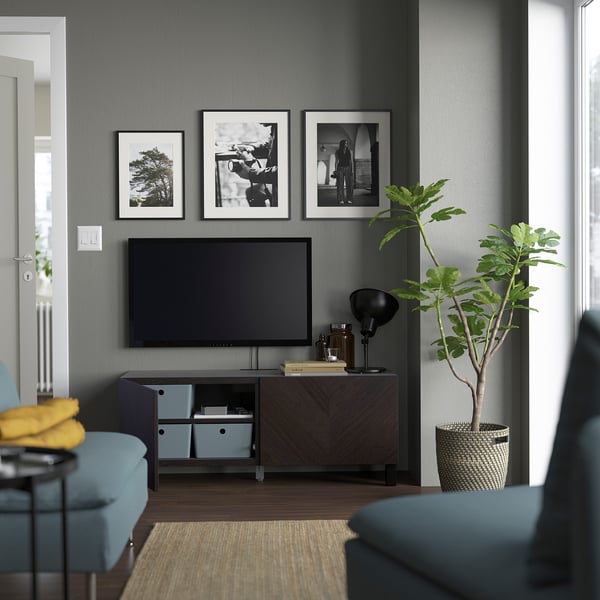 Modern living room with BESTÅ tv console, greenery, and cosy decor.