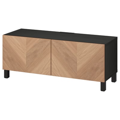 Modern black and wood tv stand; rectangular shape; two wood doors; raised legs.