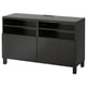Black BESTÅ tv stand: sleek, rectangular, modern design with four adjustable shelves, two cabinet doors, and cable management.