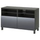 Dark grey BESTÅ tv stand: 2 closed cabinets, 2 open shelves, adjustable shelves, sleek design.