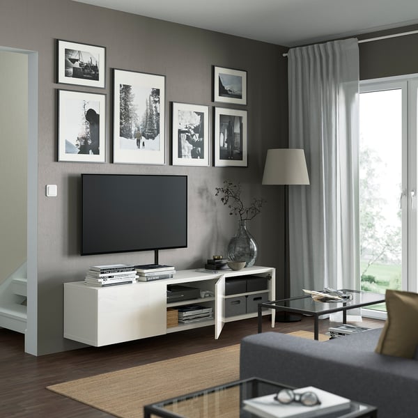 Modern living room with BESTÅ tv bench, featuring cable management, adjustable shelves, and wall-mounted design.