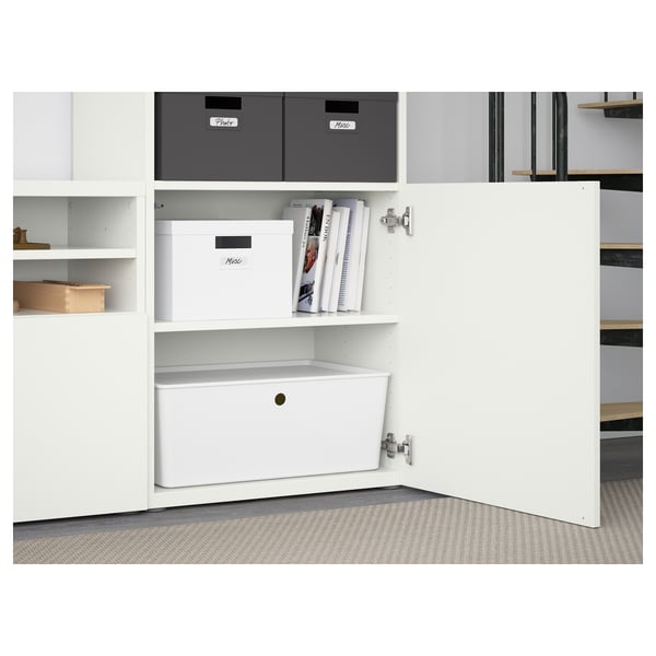 White BESTÅ unit with adjustable shelves, boxes, and soft-close drawers.