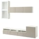 A white and beige BESTÅ tv storage unit with shelves, cabinets, and drawers, designed for organising and displaying media equipment.