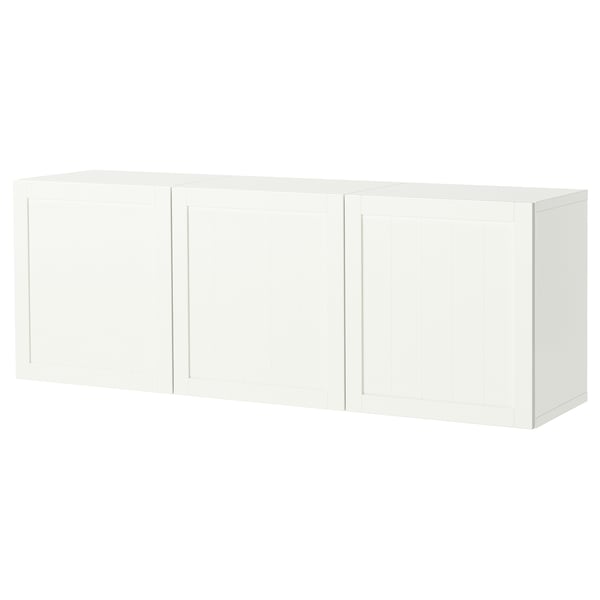 A white BESTÅ wall-mounted cabinet with three doors, offering storage and a modern look.