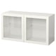A white BESTÅ storage unit with glass doors. It three shelves inside and a modern design.