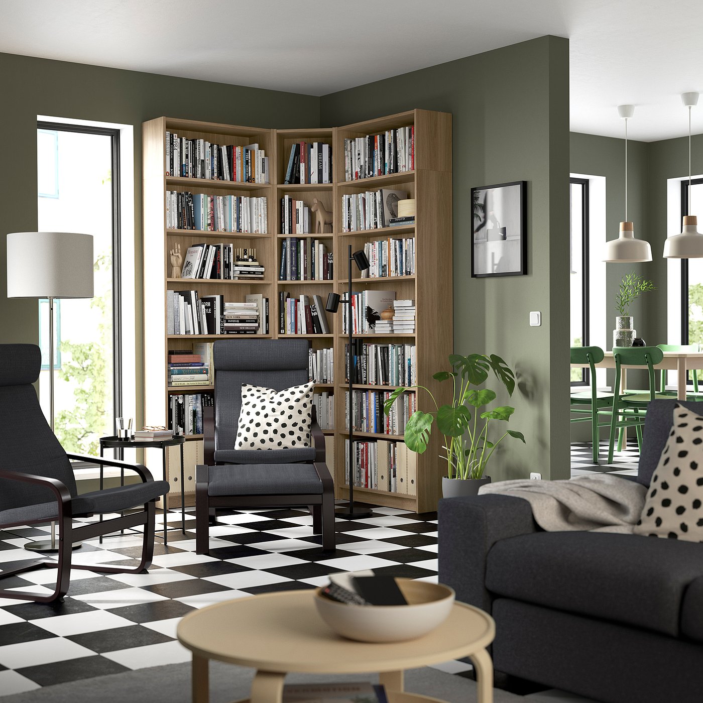 Modern living room with BILLY bookcase, grey armchairs, black & white chequered floor, light wood finish, and cosy decor.