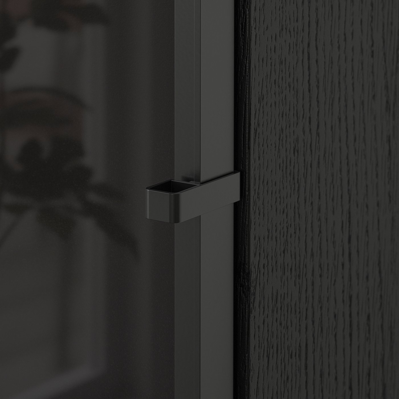 Close-up of modern, dark BILLY bookcase door with sleek handle, showcasing quality materials and design.