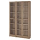 BILLY bookcase: tall brown wooden unit with glass doors, multiple shelves, classic design.