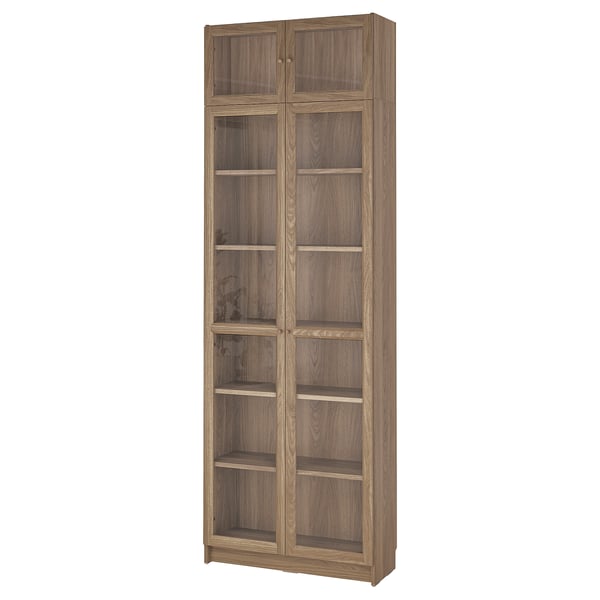 Tall BILLY bookcase, light brown, wood-like material, rectangular, glass doors.
