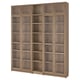 A large wooden BILLY bookcase. Its tall with multiple shelves, divided into sections with glass doors. The color is light brown.