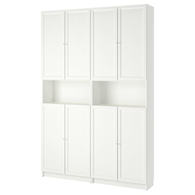 This image shows an ikea BILLY white bookcase with height extension. It has adjustable shelves and traditional inset panel doors.