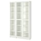 A white BILLY bookcase with glass doors and adjustable shelves.