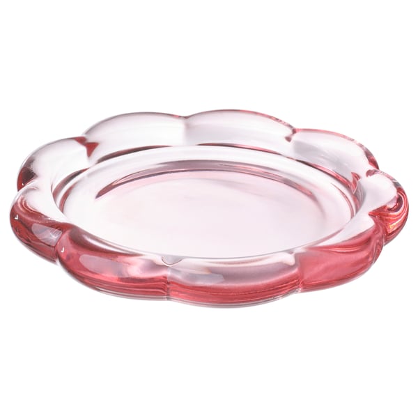 A blush pink, glass, flower-shaped BLADFÅGEL candle dish. Modern and decorative, its designed to hold pillar candles.