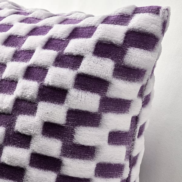 Close-up of a soft, purple and white chequered cushion cover with 3d effect, showcasing its texture.