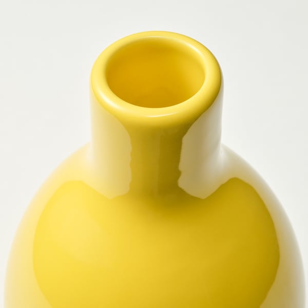Yellow vase, smooth, narrow neck, round.