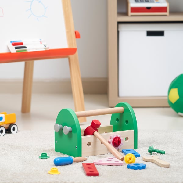 Toy toolbox with colourful tools on carpet, promoting creativity for kids 3+.