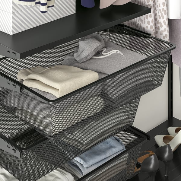 Mesh drawer organiser holds folded clothes and sweaters, part of BOAXEL wall-mounted storage system.