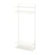 A white BOAXEL storage system. It has metal shelves and a hanging rod for closet organization.