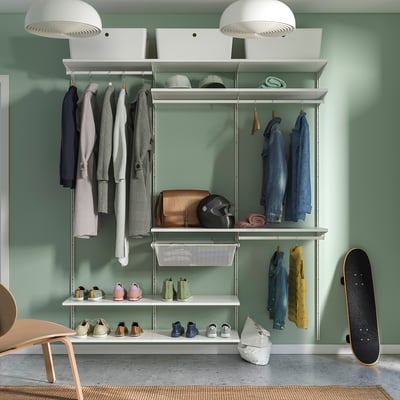Modern storage system with wardrobe, shelves & shoe rack, organised with clothes & accessories.