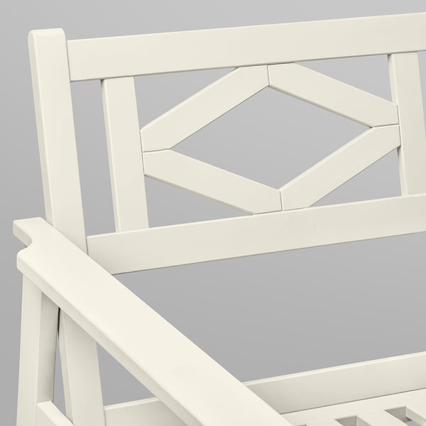 White outdoor patio furniture crafted from durable acacia wood, featuring geometric backrest design.