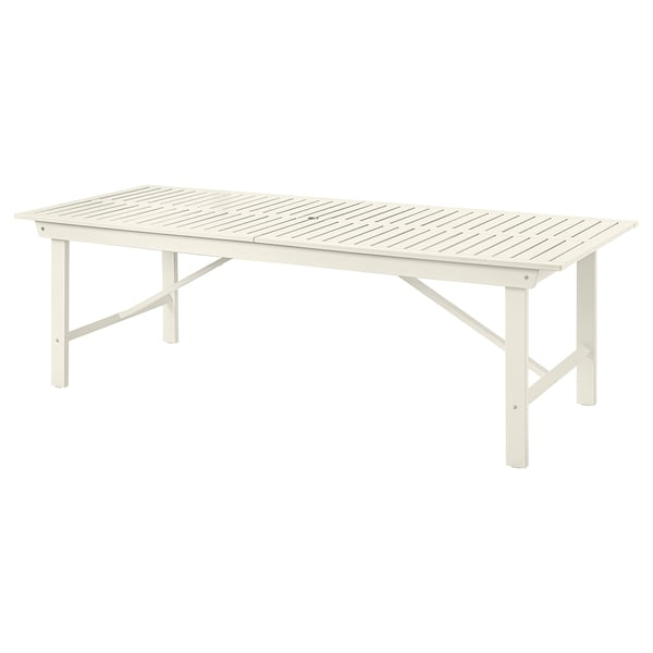 The BONDHOLMEN outdoor table in white, made of acacia wood, rectangular with foldable legs.
