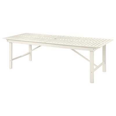 The BONDHOLMEN outdoor table in white, made of acacia wood, rectangular with foldable legs.