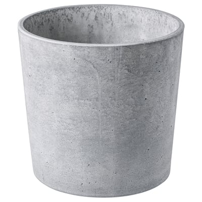 Cylindrical grey concrete planter with natural speckles, soft feet, for indoor/outdoor use.