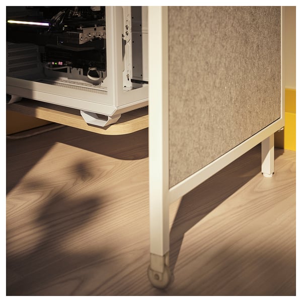 Gaming station with open side showing interior electronics, on wheels for easy movement.