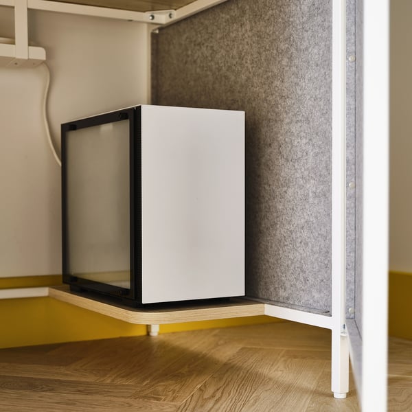 White gaming desk with drawers and shelves, designed for monitor and gear storage.