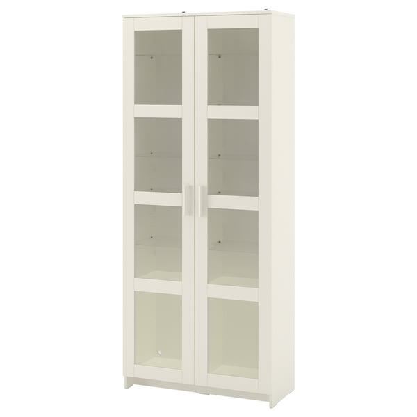 A white BRIMNES glass-door cabinet. Its rectangular with a minimalist design, showcasing tempered glass doors and shelves.
