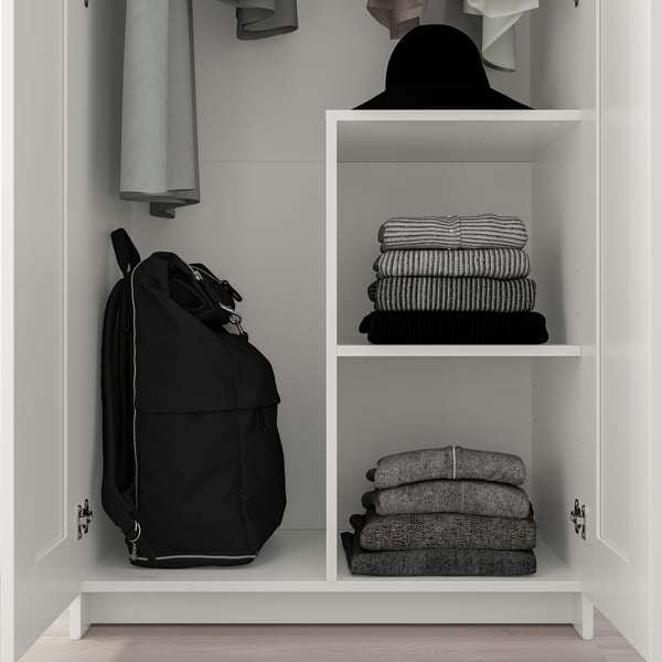 White wardrobe with clothes rail, inner shelves, and storage for folded items.
