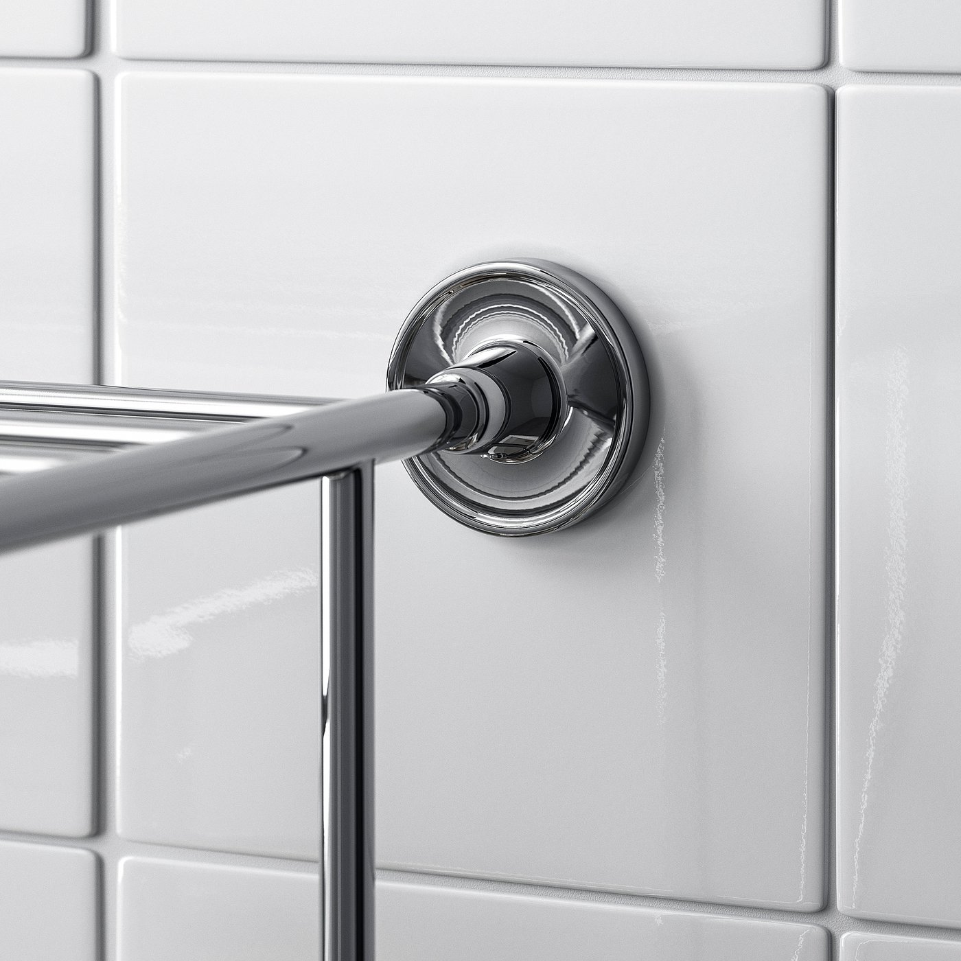 Towel rail on tiled wall with screws.