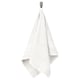 BROKGLIM white towel hangs neatly on a hook, showcasing its soft, absorbent fabric with a decorative, woven border.
