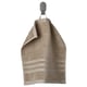Beige BROKGLIM organic cotton towel with striped pattern hangs neatly on a wall hook. Soft, absorbent with a decorative border.