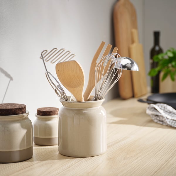 BRUGDHAJ stoneware utensil holder in off-white, holding spoons, enhancing kitchen decor.