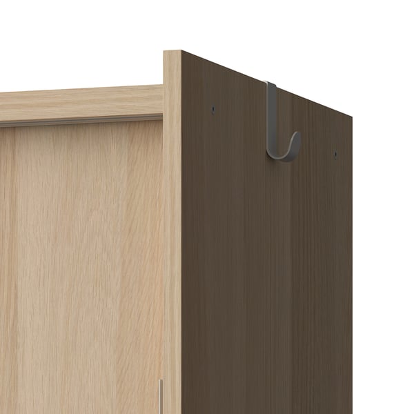 Wooden storage cabinet with multiple compartments and hooks on side for hanging items.