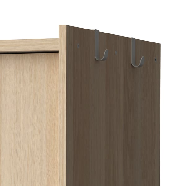 Oak wardrobe with side hooks. Holds clothes, uses space efficiently.