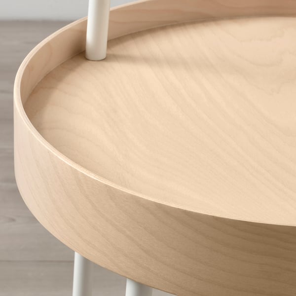 A beautifully crafted, round wooden side table with a smooth, light finish and a sturdy handle, perfect for both style and function.