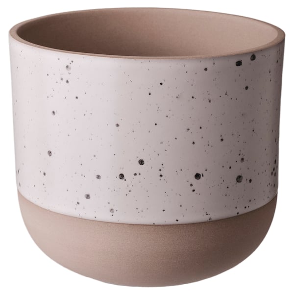 Notched ceramic planter, off-white with black speckles, smooth finish, rounded shape.