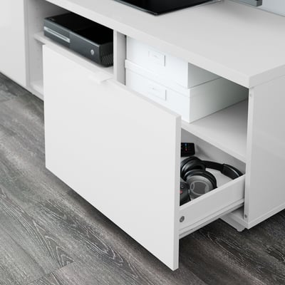 White tv stand with adjustable shelves, open for remotes, closed for storage.