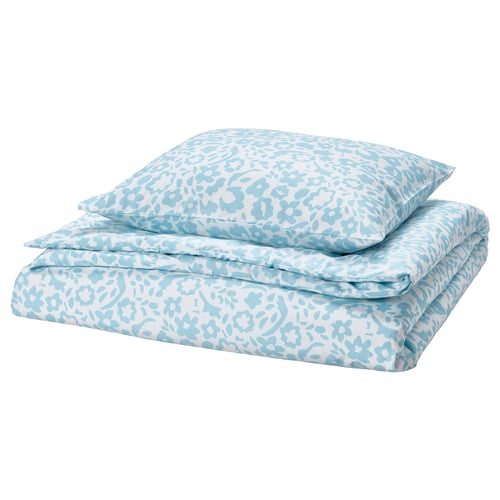 Turquoise floral bedding set, folded, featuring soft, recycled polyester fabric.