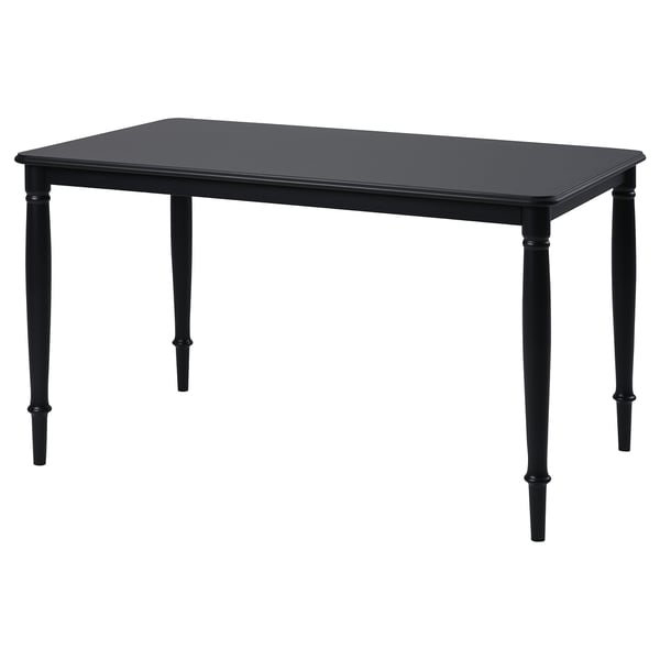 Black rectangular dining table. Four straight legs, sleek design. Durable lacquered mdf top, sturdy steel legs.