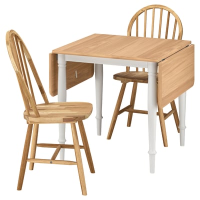 Drop-leaf table with 2 chairs, ideal for small spaces.