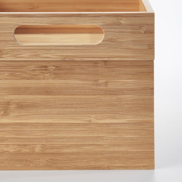 Wooden box with rounded handle, crafted from polished bamboo; showcasing a smooth, natural finish.