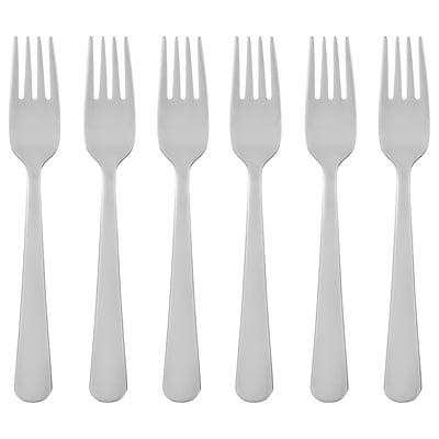Six silver stainless steel forks with long, slender handles and four tines, arranged neatly in a row.