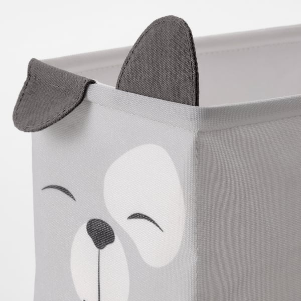 Close-up of a soft, collapsible storage bin with a cute bear face, perfect for kids rooms.