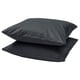 Two dark grey, plush square pillows stacked on each other.