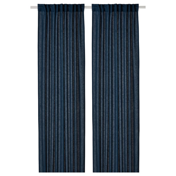 Two dark blue DYTÅG linen curtains with pleated design, hanging straight and evenly.